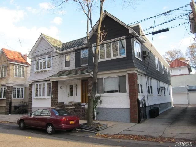 Big 2 Family Semi-Detatched W Large 15 Foot Shared Driveway, 2 Car Garage, Near Shopping, And Transportation And Near Highly Regarded P.S 113, 2nd Floor Is Vacant