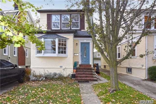 Just Arrived- Bright & Open Detached Colonial. Newer Boiler, Hardwood Floors, Tankless Hot Water Heater. Convenient To Northern Blvd- Shopping & Transportation.