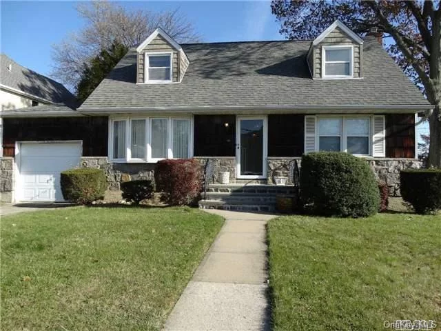 Two Bedroom Cape In Roslyn Heights. Unfinished Basement, Living Room, Family Dining Room, One Full Bath, Unfinished Second Floor.