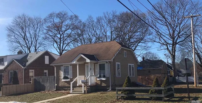 Lovely 2 Br, 1 Bath Home On Corner Lot With Great Potential! Nicely Maintained. Perfect For Investor. Full Basement, Full Attic, Large Detached 2 Car Garage. Has Sewers. Must See!