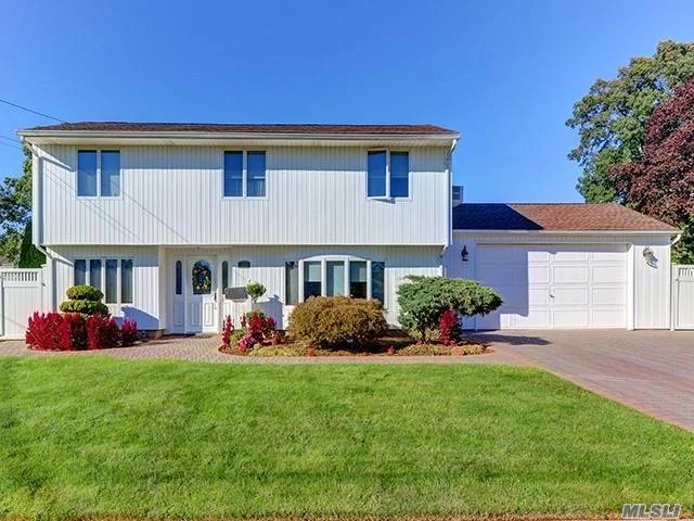 Beautiful Updated Colonial Split. Updated Windows, Siding, Kitchen And Baths. 3 Skylights In Spacious Kitchen W/ Sliders To Trek Deck. Oak Floors, Custom Railings, Unbelievable Over Sized Backyard W Pvc Fencing. Over Sized Eat Off The Floor Two Car Garage With Heat .Double Driveway With Brick Pavers. Whole House Was Re Sheet Rocked And Re Insulated