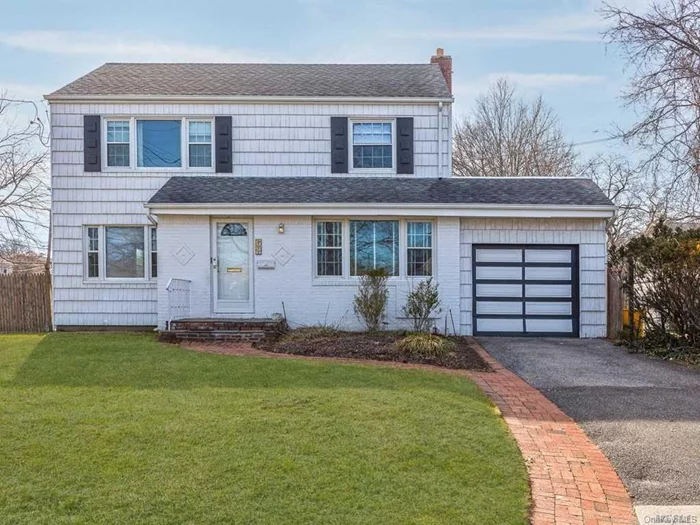 Charming Center Hall Colonial On Oversized Property In S.D.15 Formal Dining Room, Office And Master Suite On Main Level, Eik And Family Room. Three Large Bedrooms, Finished Basement, With Large Play Room, Laundry Room And Guest Room.Located In The Heart Of Woodmere.