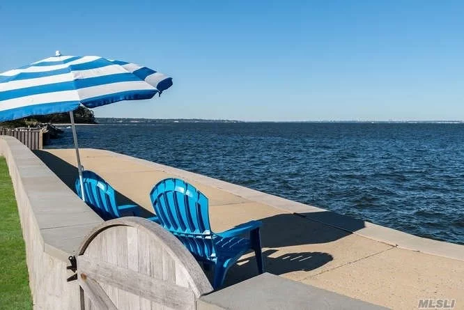 Breathtaking Waterfront Views Across Long Island Sound To New York City, Westchester And Conn. From This Large Stucco Tudor Home. A New Massive Concrete Retaining Wall Protects This Level Over-Sized Lot.