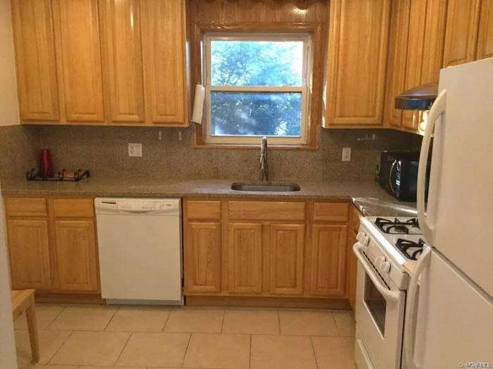 Large 2 Bedroom 1 Bath Steps To The L.I.Rr & Bell Blvd Shops. The Apt Features Gleaming Hardwood Floors Through Out, Eat In Kitchen, Heat & Water Included, 1 Parking Spot & Shared Yard.