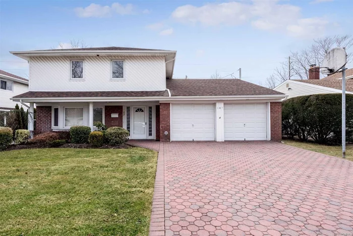 Octagonal Pavers Edged With Brick Lead The Way To This Split-Level Ranch In Manhasset Hills. Formal Lr W/Bay Window, Hardwood Floors Thru-Out, Beautiful Family Room With Doors To Rear Patio. Eik Features Stainless Appliances, Marble Flooring, Recessed Lighting & Full Backsplash. Upper Lvl Is The Master Suite W/5 Closets And Updated Bath. 3 Add Bedrooms & Bath. Herricks Sd.