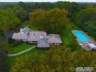 Old Westbury. A Totally Professionally Landscaped and Designed 2+ Acres with a Gunite Pool, Hot Tub and Cabana with a Kitchen, frames this 7 Bedroom, 5.5 Bath Expanded Slate Roof, CAC Ranch. Tradition Combined with Luxury Upgrades Provides a Great Background for Parties and Celebrations. The Pool & Cabana Are Open and the Property Is Blooming with Flowers.