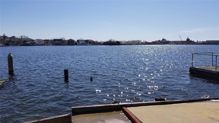 Right On The Water 125X100 - Zones M1 With Two Family House In Very Good Condition.