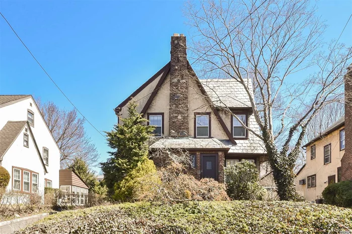 Location! Location! Location! Wonderful And Sunny Tudor Close To Everything! Updated Eat In Kitchen With Pocket Doors To Enclosed The Kitchen. New Stove And Exhausted Fan, New Den W/ Skylight And Sliding Door To The Backyard. Updated Bathroom With Skylight. 3 New Ductless A/C Unit, New Window On The First Flr. New W/D, Full Basement W/ Tile Floor. Near Public Transportation, 25 Min Lirr To Nyc