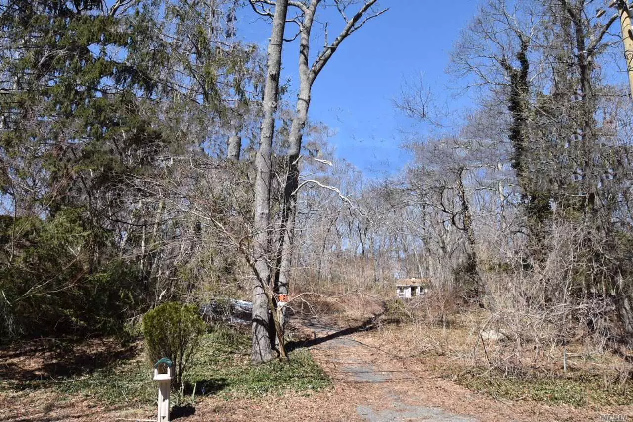 Large Buildable Lot Backs To Jonathan Path. Minutes To Acres Of Private Beaches.