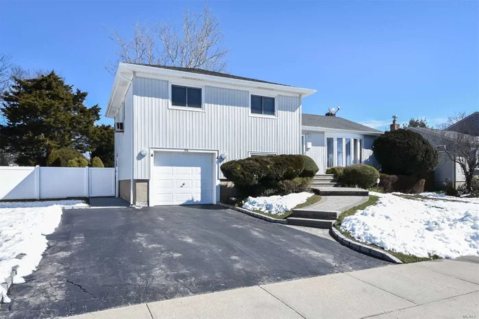 Sundrenched Split With Stunning Den Addition Featuring A Cathedral Ceiling, A Wood Burning Fire Place For Cold Winter Nights And Sliders To The Deck For Warm Summer Days. Shining Refinished Wooden Floors. Newly Renovated Main Bathroom. Perfectly Maintained. Brick Pavers Lead To A Landscaped Rear Yard In This Quiet Neighborhood. Bethpage Schools. Convenient To All.