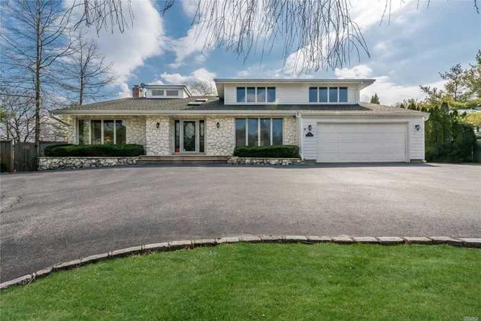 Gorgeous, Spacious Contemporary Home. 5 Large Bedrooms, 3 1/2 Baths. On More Than 1/2 Acre. Large Eik, Butlers Pantry, Elegant Formal Dining Room, Living Room, Den With Wood Burning Fireplace. Full Finished Basement, Gunite Heated Pool, Gas Heat, 2 Car Garage, Circular Driveway On Cul De Sac,  Syosset Schools! A Must See!