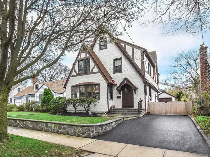 4 Bedroom 2.5 Bath Timeless Tudor With Old World Charm And Authentic Detailing Throughout Has Over 2000 Sq Ft Of Living Space On A Quiet Tree Lined Street In The Desirable Park Section. Enjoy Relaxing In The Large Living Room With Fireplace Or Entertaining In The Oversized Dining Room. Gracious Home Has Renovated Kitchen W/Farmhouse Sink, Granite Counters & All New Stainless Appliances & Custom Cabinetry.  Master Bedroom W/Vaulted Ceiling & Masterbath, 3 Bedrooms, Full Bath....