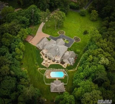 Spectacular Brick Estate Home On Shy 5 Lush Acres In Prestigious Muttontown. In-Ground Gunite Pool With Pool House, Open Space Living Room, Every Possible Amenity, Great Room With 36 Ft. Ceiling Height And Walls Of Glass Overlooking Breathtaking Grounds, Finished Basement, Gated Entry Provides Complete Privacy.