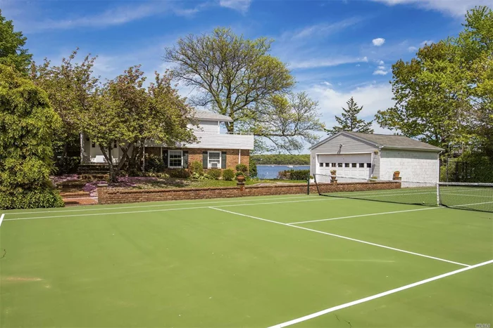 Fabulous Opportunity To Live On The Water And Have A Tennis Court.5 Bedroom Home With Water Views From Most Rooms. Large Entertaining Rooms That Open Onto A Porch And Patio. Play A Match And Then Watch The Sunset On Your Deck All Year Round.