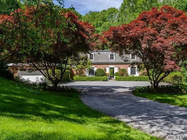 Charming French Style Brick Colonial Tucked Away On 2.6 Secluded Acres With Specimen Trees. Courtyard Entry. Gracious Entertaining Rooms Open Onto Brick Walled Terrace.New Kitchen. Generator For House.