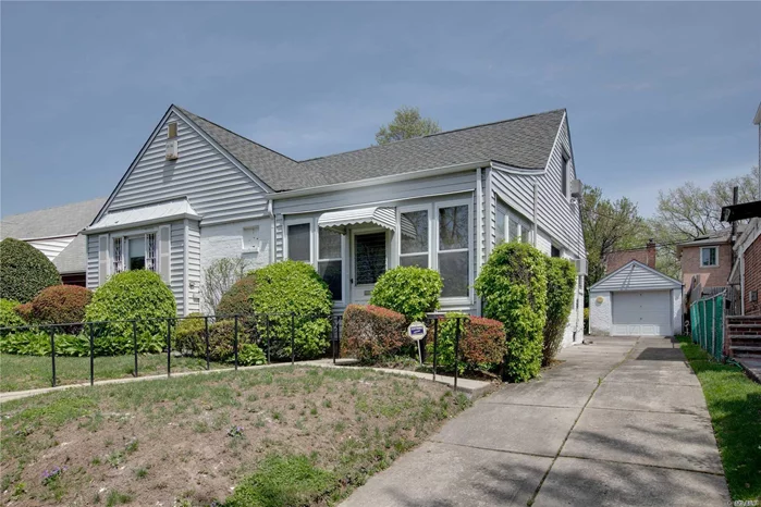 Charming Expanded Cape, Perfectly Positioned On A 55X100 Lot In One Of The Most Desirable Sections Of Bayside Within Oakland Gardens.  This Spectacular Home Boasts An Effortless Flow Through Out Approximately Over 1, 900 Sq Feet And Offers 5 Bedrooms, A Seasonal Family Room, An Eat In Kitchen, Dining Room, 2.5 Bathrooms, Living Room And A Full Finished Basement With A Billiard Room And A Wet Bar. Private Landscaped Yard. Private Driveway And A Detached Garage.