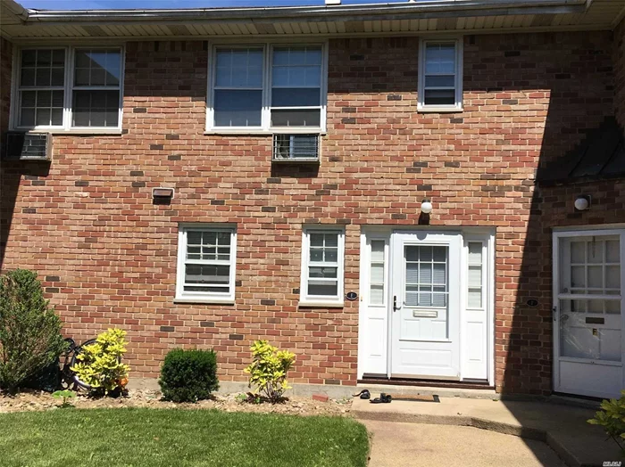 Two Bedroom Courtyard Apartment Directly Across The Street From Manorhaven Community Park, Beach And Pool. Updated Kitchen And Baths.