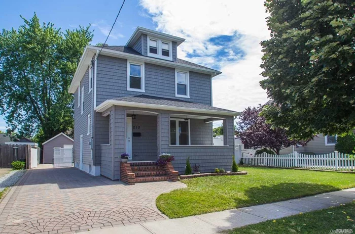 Totally Remodeled Colonial In Heart Of Lindenhurst, Walking Distance To Village And Lirr. Brand New Roof, Siding, Refinished Hardwood Floors, Open Concept With Beautiful Eik W/ Quartz Counter Tops And Stainless Steel Appliances. 2 Brand New Bathrooms, Freshly Painted.