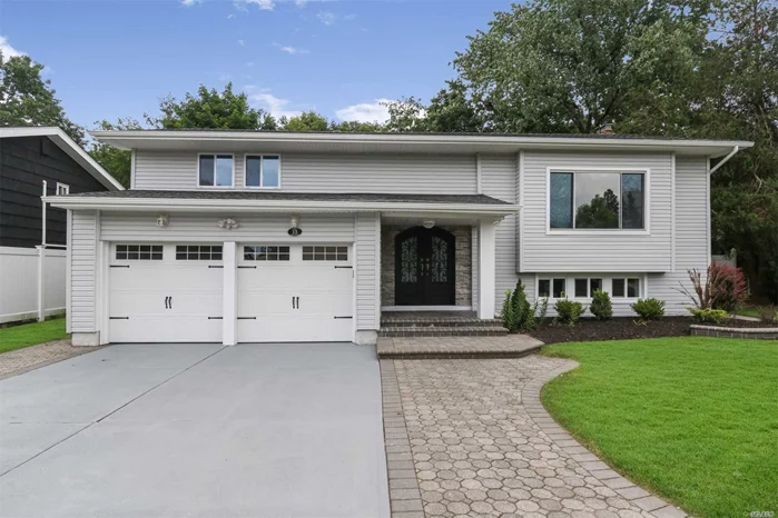 This Completely Redesigned Split Is Situated On A Quiet Road In The Magnificent Syosset School District. This House Has Been Completely Remodeled With An Updated Kitchen With Stainless Steel Appliances, New Siding, Roofing, Windows, Hardwood Floors, Patio, Grand Entrance And A Lot More.Very Generous Living Space And Stylish Finishes, You&rsquo;ll Feel Right At Home. This House Is A Must See.