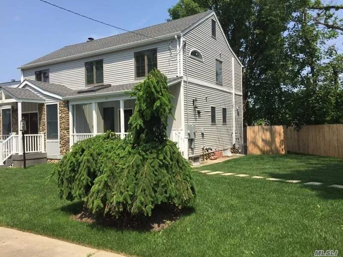 Beautifully Renovated Inside & Out, 2-Family Village Colonial, Close To All, Radiant-Heated Main Fl; Charming & Usable Front Porch, Updated Galley Kitchen W/Ss Appliances;Fenced Side Yard;Bright & Cheerful;W/D In Basement;Manhasset Schools;Convenient To Town, Train, Middle & High Schools.This Unit Is Entered Thru Lovely Front Porch. Water & Lawn Care Inc.