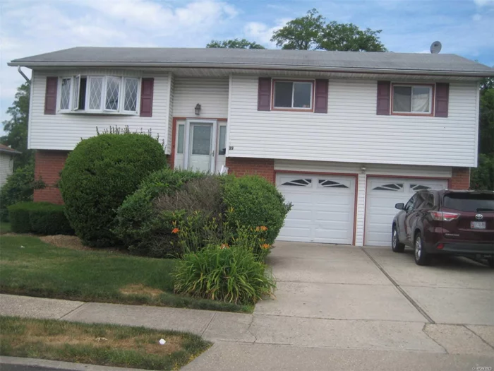 Beautiful L Oversized High Ranch.Updated Kitchen . House Needs Some Tlc. Brand New Deck Is Being Installed.