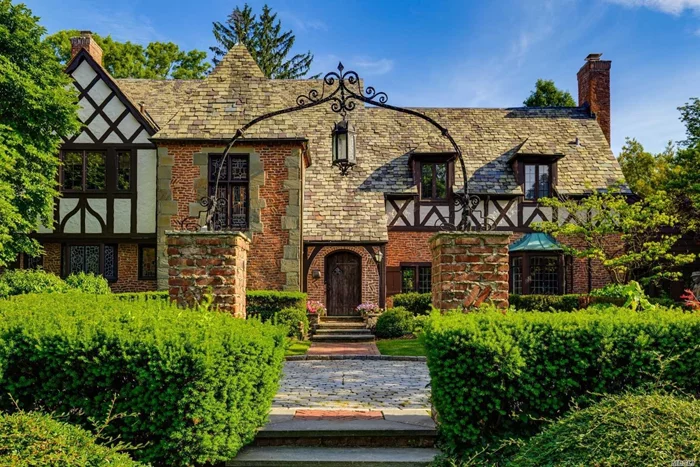 Rare Offering!! Giant English Tudor Manse In Prestigious Windsor Gate Cul De Sac W/ Private Park.  Majestic Features Include High Ceilings, Large Rooms, Staff Wing, Exposed Brick, Artisinal Stained Glass, Lush Grounds W/ Bricked Patios.Recent Mint Renovation! Fireplace, Separate Living + Family Room, Den, Glass Cathedral Breakfast Room, Renovated Chefs Kitchen, Luxe Master And Bath W/ Extensive Closets, Sunroom, Windowed Basement W/ Bar. Private Golf, Pool, Police, Day Camp, Tennis, A+ Schools