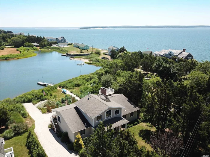 Located On A Protected Inlet W/ Direct Access To The Bay, This Pristine Traditional Home Has Everything You Need. Living Room W/Gas Fplc, Large Dining Room, & High-End Eat In Kitchen, All In An Open Plan Leading To An Expansive Deck Overlooking West Lake & Peconic Bay.Spiral Staircase Leads To The Deep Water Dock Or To The Roof Deck W/ Views Of Robins Island & Beyond. Light & Bright Lower Level Consists Of Living Space, 2 Beds, Wine Cellar, & Walls Of Sliding Doors. Private Beach Access.