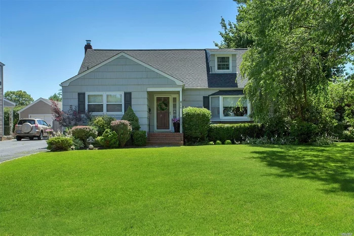 Expanded And Maintained Cape In Lawrance Farms Featuring Formal Living And Dining, Fam Rm W/Fireplace, Eik Open To Deck, 4 Beds, 2 Baths, Sun-Porch, Finished Basement Playroom, New Roof, Wood Floors, 2 Car Detached Garage. Do Not Miss This Great House.