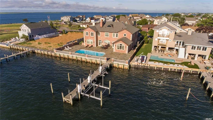 Majestic Brick Bayfront Home Built In 2008 With Every Amenity Known To Man. No Expense Spared & Only The Finest Materials Used. Savor The Beautiful Bayviews & Store Your Boat & Jet Ski Safely On The Lift On The 61 Foot Pier Then Take A Dip In The Saltwater Pool.  Livin&rsquo; L A R G E ! ! !