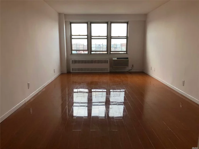 Spacious Unit Located In A Very Well-Maintained And Financially Sound Concrete Hi-Rise Building.Large Livingroom Allows For Year Round Enjoyment Of Natural Lights, Breathtaking Skyline View.Hardwood Floor Throughout, Updated Kitchen And Bathroom, Low Maintenance Fee Includes All Utilities. Minutes To 7 Train, Lirr, Library, Supermarkets, Restaurants, Shopping Center And Much More.