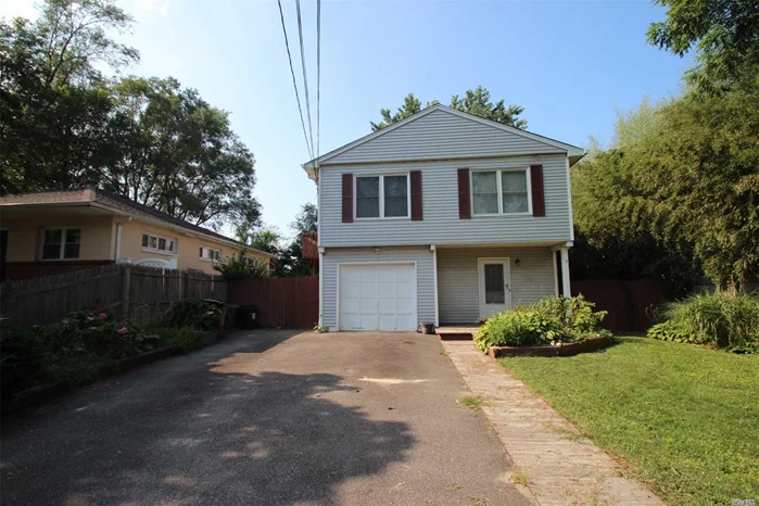 Large Kitchen W/ Sliders To Large Balcony Deck- Low Taxes-Flat Yard W/Room For Pool-Easy M/D W/Spt Entry- Great For Large Family! Easy Income- Great For Investor- Close To All Shopping & Expressways-Gas Heat-Central Air- Nice Quite Area- Large Multicar Driveway With Attached Garage-Entry From Garage Into Home-