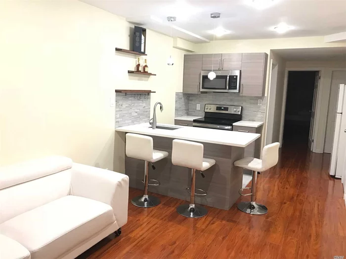 First Floor Unit In A Multiple Family Building. This Rental Unit Has Two Bedrooms, One Full Bath, New Open Style Kitchen With Living Room, And New Floors. There Is A Direct Access To Backyard. Only 2 Blocks From Subway Station #7 Train, 15 Min To Manhattan, Close Proximity To Supermarket, Park, Library, Laundry, And Highway.