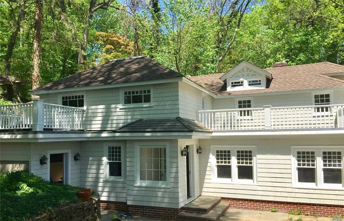 Nestled Into The Hillside, This 4 Bedroom, 2.5 Bath Colonial Has Old World Charm And Modern Upgrades.Separate Includes 2 Story Separate Artists Loft. Half Acre Property W/Lush Landscape, Mstr Br W/Bath, Living Room W/ F/P, Dining Rm, Huge Gourmet Eik W 4 Skylights, S/S Appliances, Stylish Bathrooms, Oak Flooring, Cac, Gas Heat, Bluestone Patios, Pt Wash Lirr Sticker, Roslyn Sd.Easy To Show.