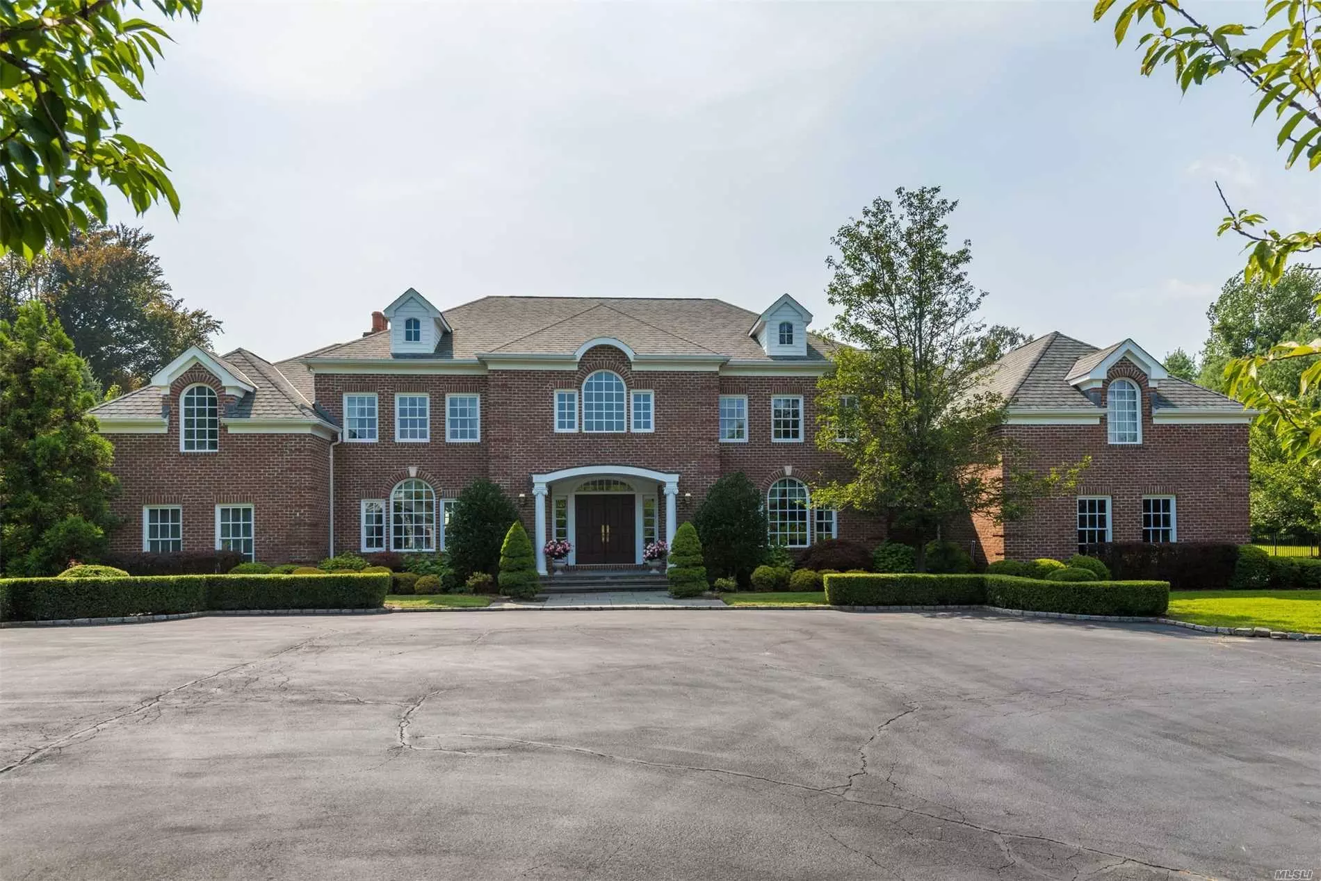Fabulous 7000 Sq Ft Brick Colonial On One Of The Most Desirable Streets In Old Westbury. Built In 2004 On Over 4 Beautiful Acres With A Heated Ig Pool.