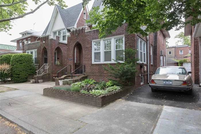 Beautiful Brick Detached Tudor, Featuring New Appliances, 5 Year Old Roof, 2 Year Old Windows,  5 Year Old Burner, Parquet Floors, Sun Room, Attic With Pull Down Stairs. Finished Bsmt With Separate Entrance, Private Fenced In Yard, Detached Garage, Many Top Of The Line Extras!! A Few Blocks To The Lirr (25 Minutes To Manhattan),  A Couple Of Blocks To Local Buses And Bayside Hub Shopping!!