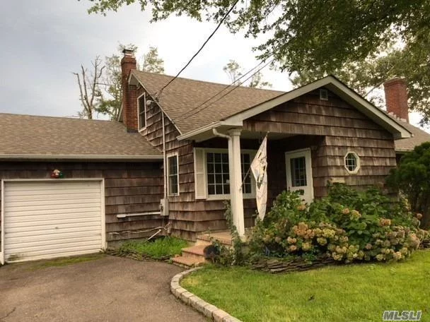 Charming Cape Within Walking Distance To Gorgeous Long Island Beaches. Home Boasts 3 Bedrooms 1 Bath, Cozy Living Room With Fireplace, Wood Floors, Nice Sized Dining Area For Entertaining. Perfect Home To Start A Family In. Sold As-Is.