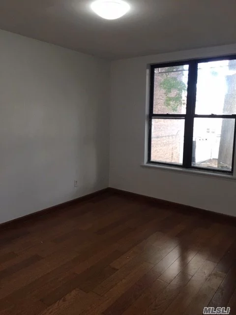 Newly Renovated 2 Bedrooms, Can Be Converted To 3 Bedrooms, Updated Kitchen With Exhaust Hood And Full Bath. Spacious Layout, Bright, High Ceiling, Hardwood Floors And Lots Of Closets.  Great Location!! Between 34th Ave And 153rd St. 2 Blocks Away From Northern Blvd. Close Proximity To Major Transportation, Q13, Q15 Q28, Shopping, Supermarkets, And Restaurants.