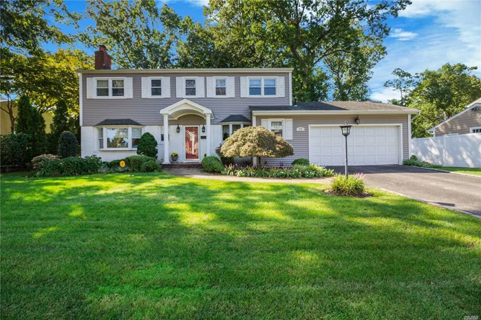 Oyster Bay At Its Finest! Spacious Center Hall Colonial In Desirable Forest Estates Pool Community, Sited On Fully Fenced Professionally Landscaped Property. This Home Offers A Formal Living Room With Sliders That Open To A Trex Deck, Family Room W/ Fireplace, Oversized Formal Dining Room, Eat In Kitchen W/ Granite Counters, Laundry Room, 2 Fl Bths & Powder Room, Master Suite W/ Walk In Closet, 3 Large Bedrooms, Gleaming Hardwood Floors Throughout, Finished Basement, 2 Car Garage, Cac..Must See!