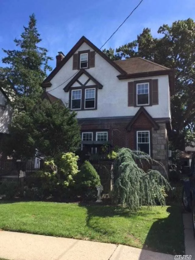 Mid-Block Tudor Colonial In The Heart Of West Hempstead. Living Room W/Fireplace, All Hardwood Floors Must See To Be Appreciated. Close To Parkway And Transportation. Location, Location, Location....