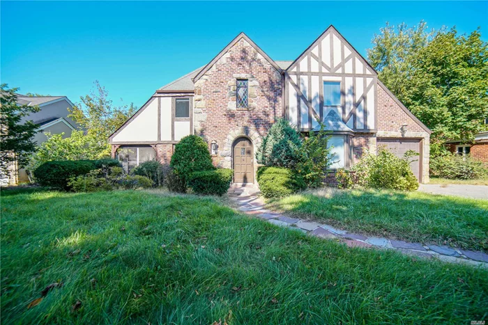 Picture Perfect Tudor. Enjoy Old World Charm With Modern Interior. Gracious First Floor Offers Living Room With Fireplace, Formal Dining Room, Contemporary Kitchen, 1/2 Bath, Screened In Porch And Attached Garage. Second Floor Has Master Suite W/ Private Bath + 2 Walk-Ins, 2 Additional Bedrooms And Full Bath. Hardwood Floors Throughout.. Full Finished Basement With Laundry Room.