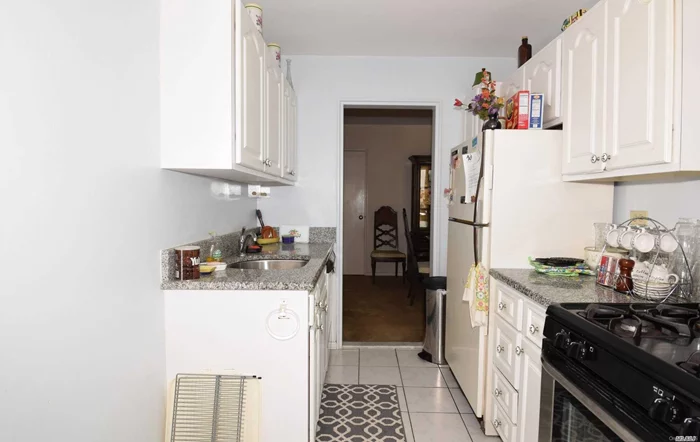 Minimum 20% Downpayment Required For This Sunny And Spacious 1100 Sq Ft (Junior 4) Corner Unit Apartment In A Great Building-Largest Junior 4 Model. Maintenance Includes All Utilities (Heat, Water, Gas, Electric). Convenient To Transportation, Express Bus To Manhattan And Bay Terrace Shopping. Elevator Building! Parking Space Available $31/Monthly. Plenty Of Closets Throughout. Seller Pays Waiver/Flip Tax.