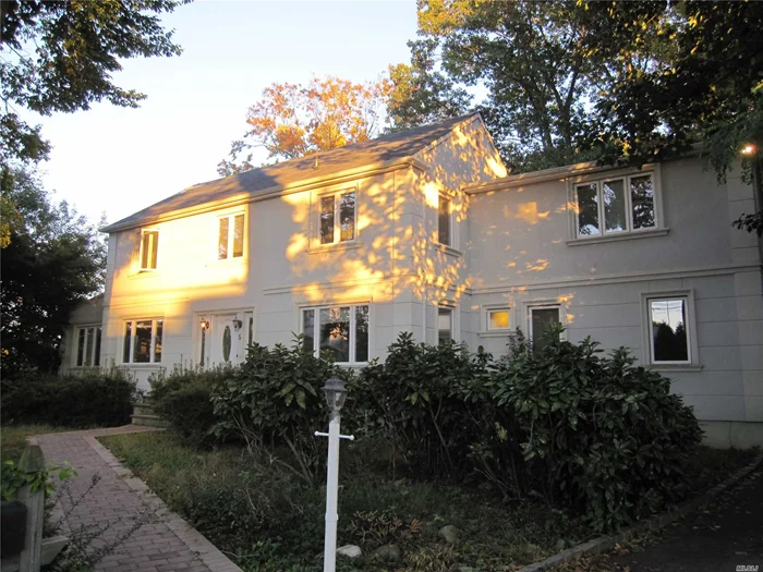 Beautiful Completely Renovated Stucco Center Hall Colonial With Natural Light Through Many New Windows, Spacious Rooms, Eat-In-Kitchen Opens To Large Deck Overlooking Private Flat Backyard, Steps From Steppingstone Waterfront Park In The Prestigious Village Of Kings Point With It&rsquo;s Own Police, Low Taxes, Magnificently Private Location, Walk To Bus Stop, Only 20 Min On The Train From Manhattan, Easy Access To Northern Blvd.