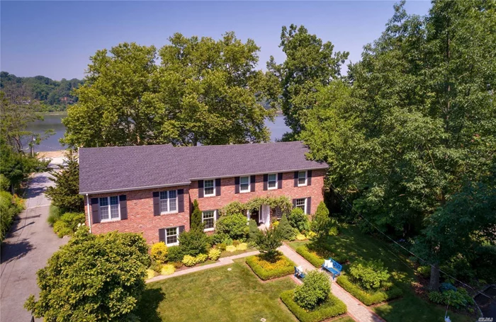 Manhasset Bay Waterview Lovely 5 Bedroom Brick Colonial. Enjoy This Tranquil Setting. Well Appointed Rooms Throughout. Bonus-2nd Floor Bedroom Suite Featuring Br, Lr, Full Bath, Walk In Closet And Private Staircase. Wonderful Landscaped Property. Deeded Water Rights.