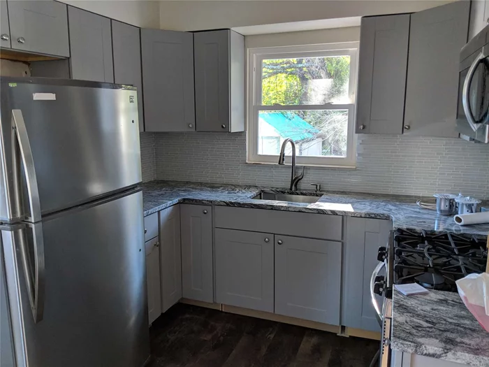 Totally Renovated, All New Appliances. Master Bedroom With Half Bath, Hardwood Floors Throughout. Located Close To Train Station And Bus.