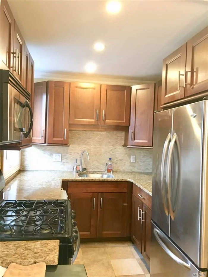 Corner Unit, Gorgeous Custom Renovated Kitchen, Beautiful Hardwood Floors, Custom Radiator Covers, Granite & Stainless Steel Kitchen, Close To Lirr, Close To Shopping