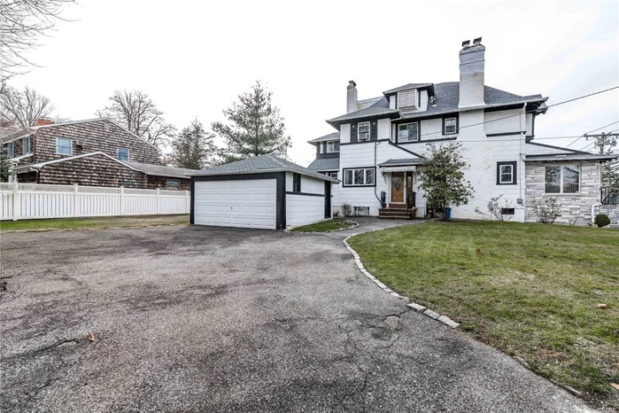 Handsome Tudor-Esque Colonial In Douglaston Neighborhood,  Featuring Large Finished Basement, Master Suite With Dressing Room And A Oversized Guest Suite With Full Bathroom. This Spacious Home Is Nestled On A Large Land 94X100 With Old World Charm And Details Thru-Out!