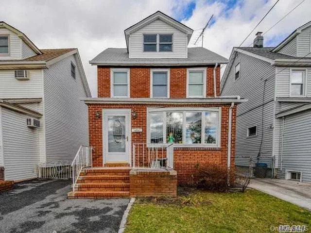 Beautiful Colonial In Desirable Bayside With Newly Renovated 1st Floor! Living Room, Dining Room, Beautiful Eat In Kitchen, Gorgeous Tile Floors Throughout First Floor, 3 Bedrooms, 1 Full Bath, Walk Up Attic, Full Unfinished Basement, 2 Car Detached Garage. Don&rsquo;t Miss This Fantastic Home!