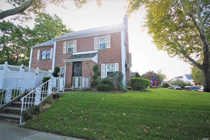 Detached And Expanded Brick Colonial On A Bayside Hills Corner Property; Featuring An Ensuite Master Bedroom, Living Room With Fireplace, Finished Basement, H/W Floors And An Eat-In Kitchen That Opens To A Family Room With Sliding Doors To A Private Patio And Hot Tub. Lots Of Improvements Including New 3-Zone Gas Heat And In-Ground Lawn Sprinklers. Great Location Near Mass Transit (Q27 And Q31 Buses) And Schools (Ps 203 And Ms 158).