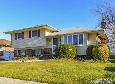 This Expanded Split Is Just Waiting For Its New Family To Move In! This Home Offers 3/4 Bedrooms & 2 Full Baths On An Oversized Property With Extra Parcel. Expanded Family Room, Large Br/Office W/Ose. (Poss M/D), Finished Basement, Expanded Eat In Kit With Sliders To Backyard. Gleaming Hardwood Floors Throughout. Award Winning Plainedge Schools!