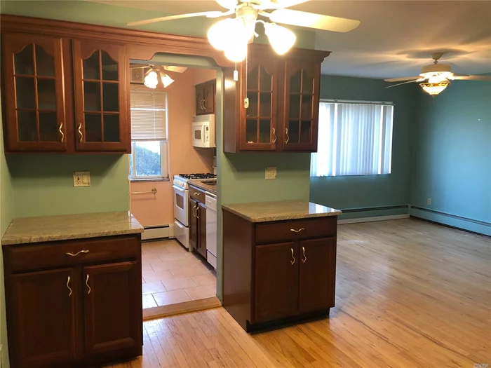 First Floor - Large 2 Bedroom Bright And Sunny Unit With Beautiful Granite - Galley Kitchen, Updated Full Bathroom, Hard Wood Floors And Parking Spot! Laundry In Building And Storage Unit.